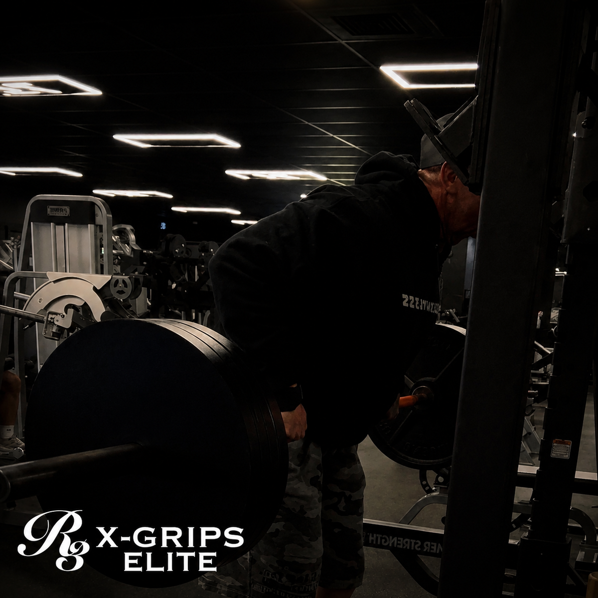 Person lifting weights in a gym with 'X-Grips Elite' branding.
